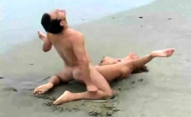 busty-milf-enjoys-passionate-sex-with-her-lover-on-the-beach