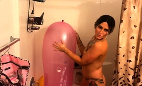 tattooed-babe-teasing-with-a-big-balloon-in-the-shower