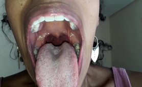 Ebony Girl Opens Her Mouth Wide And Pulls Out Long Tongue